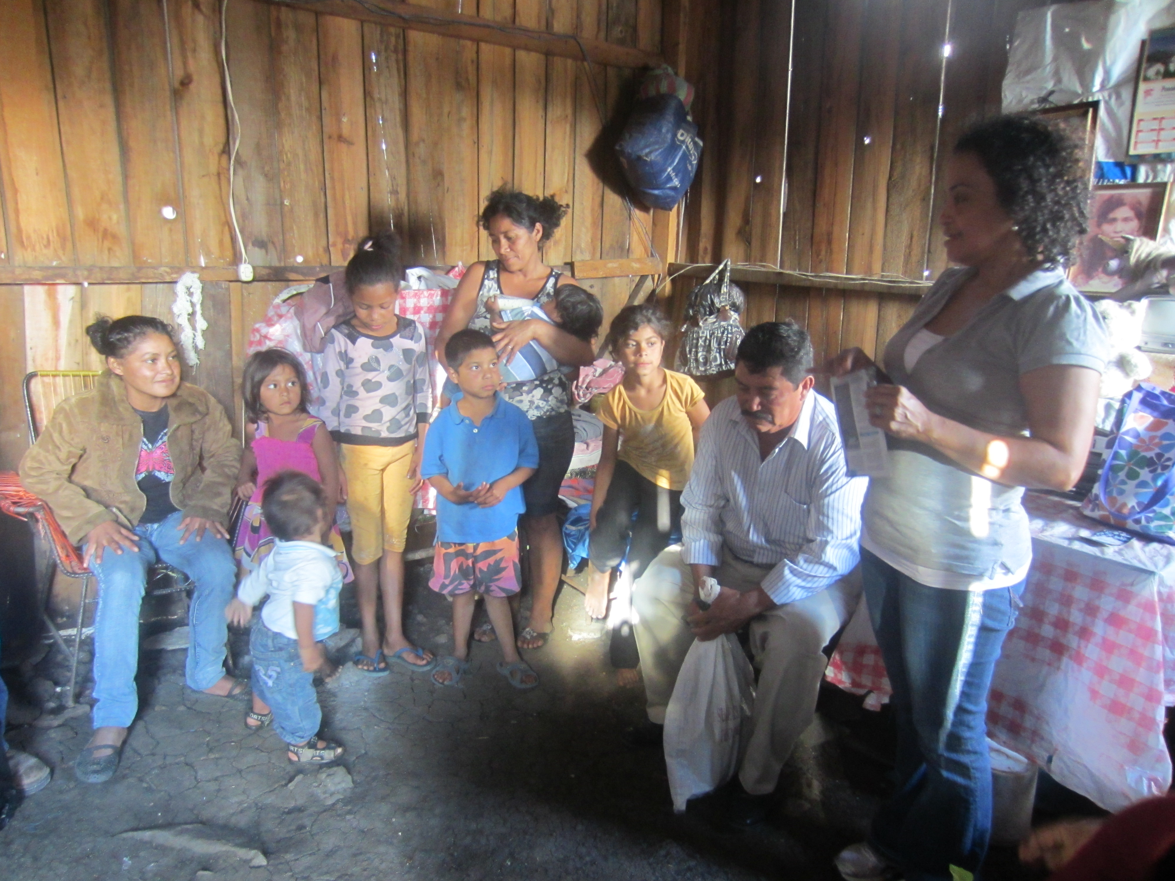 Alex shares Christmas story with family of blind girl on left.